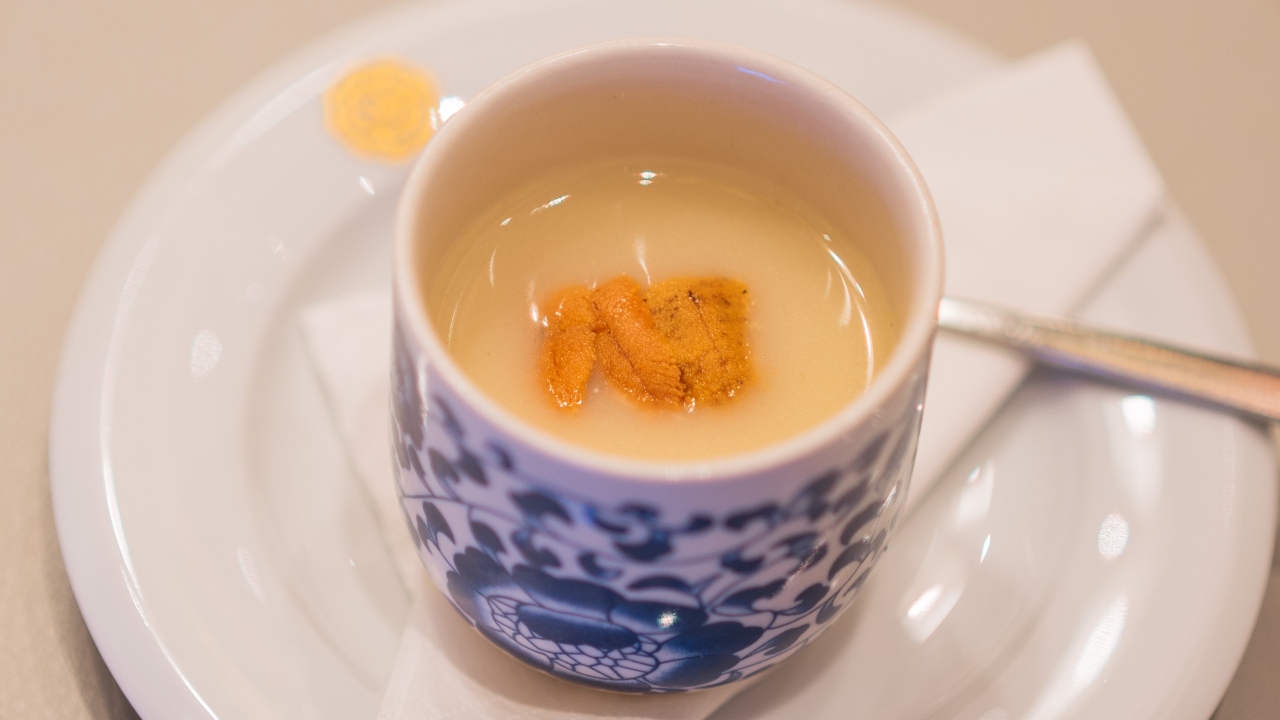 An uni-topped chawanmushi with dry-aged chicken dashi.