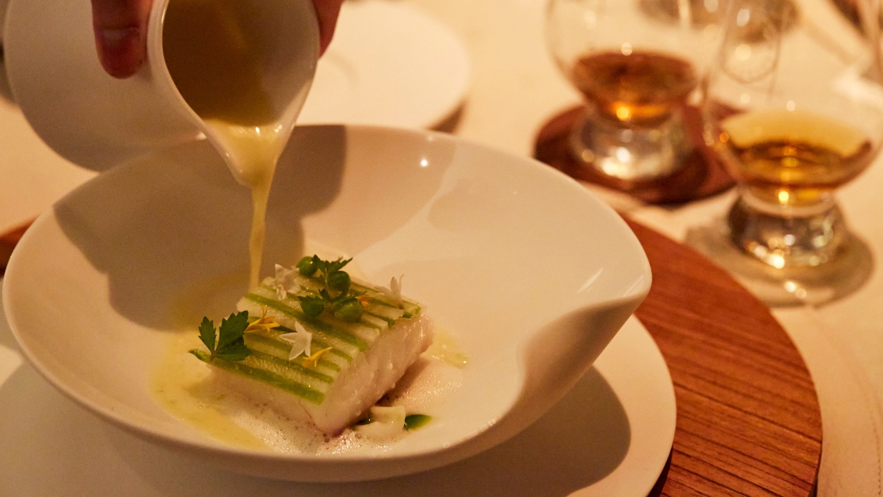 Sea bream with white clams, squid, yuzu foam and sweet peas.