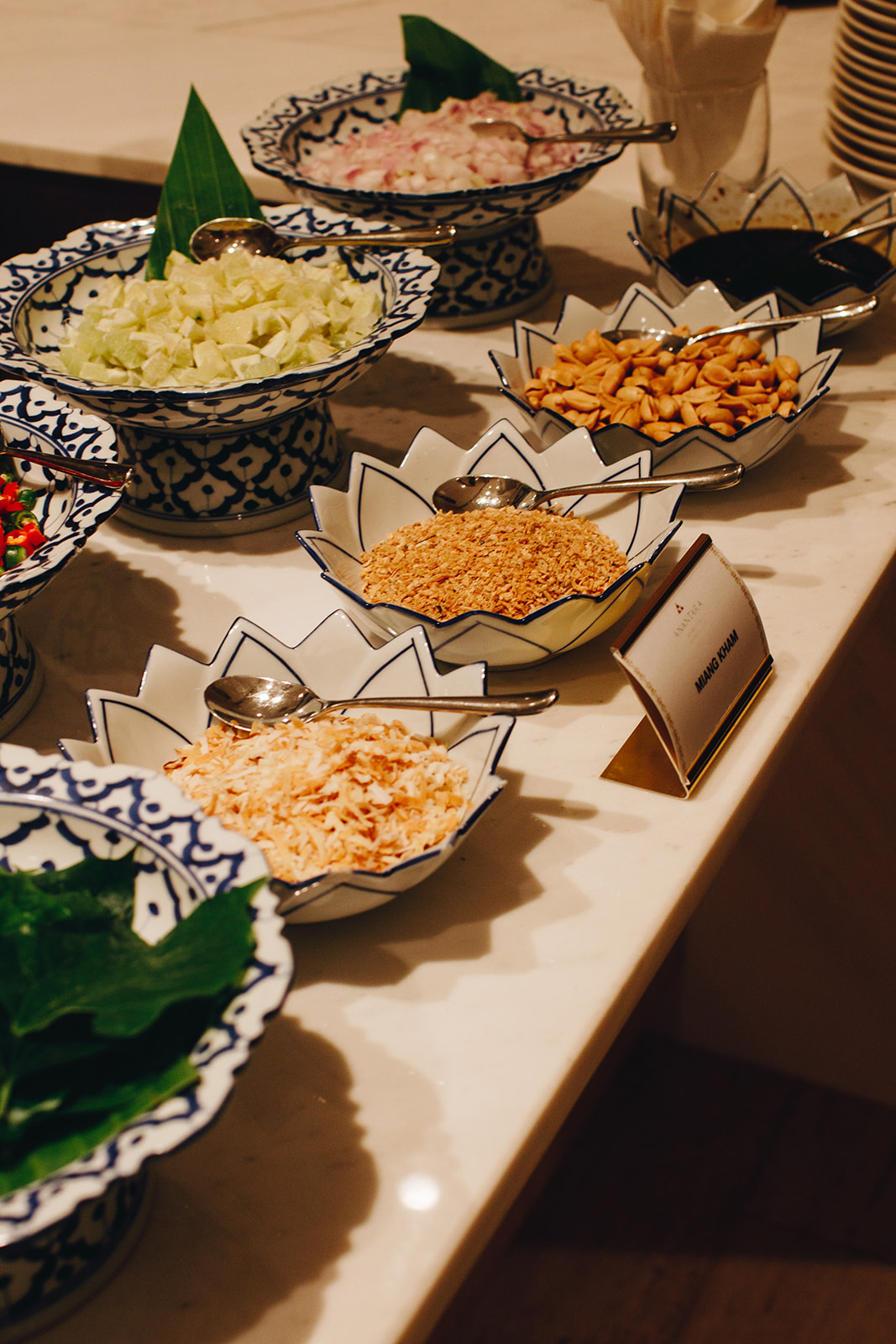 Condiments for refreshing miang kham, leaf-wrapped salad bites.